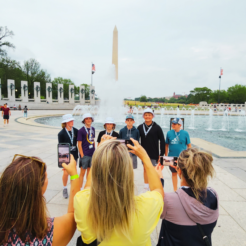 Teachers taking a picture of their students near the Washington Monument